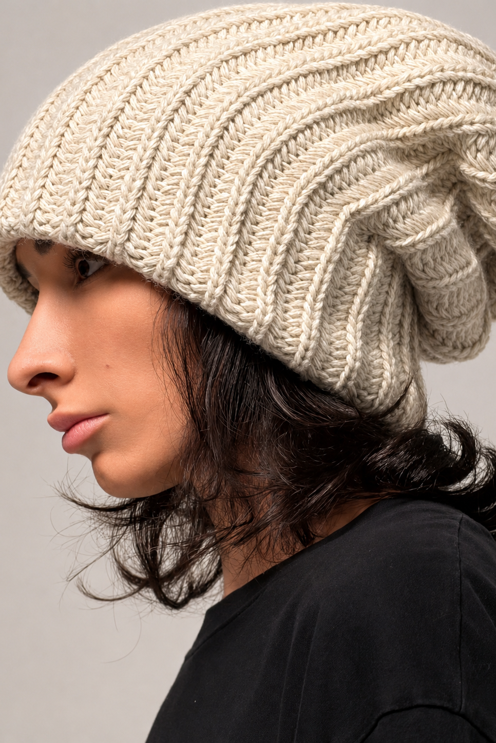 Beige oversized knit beanie with chunky texture and relaxed silhouette