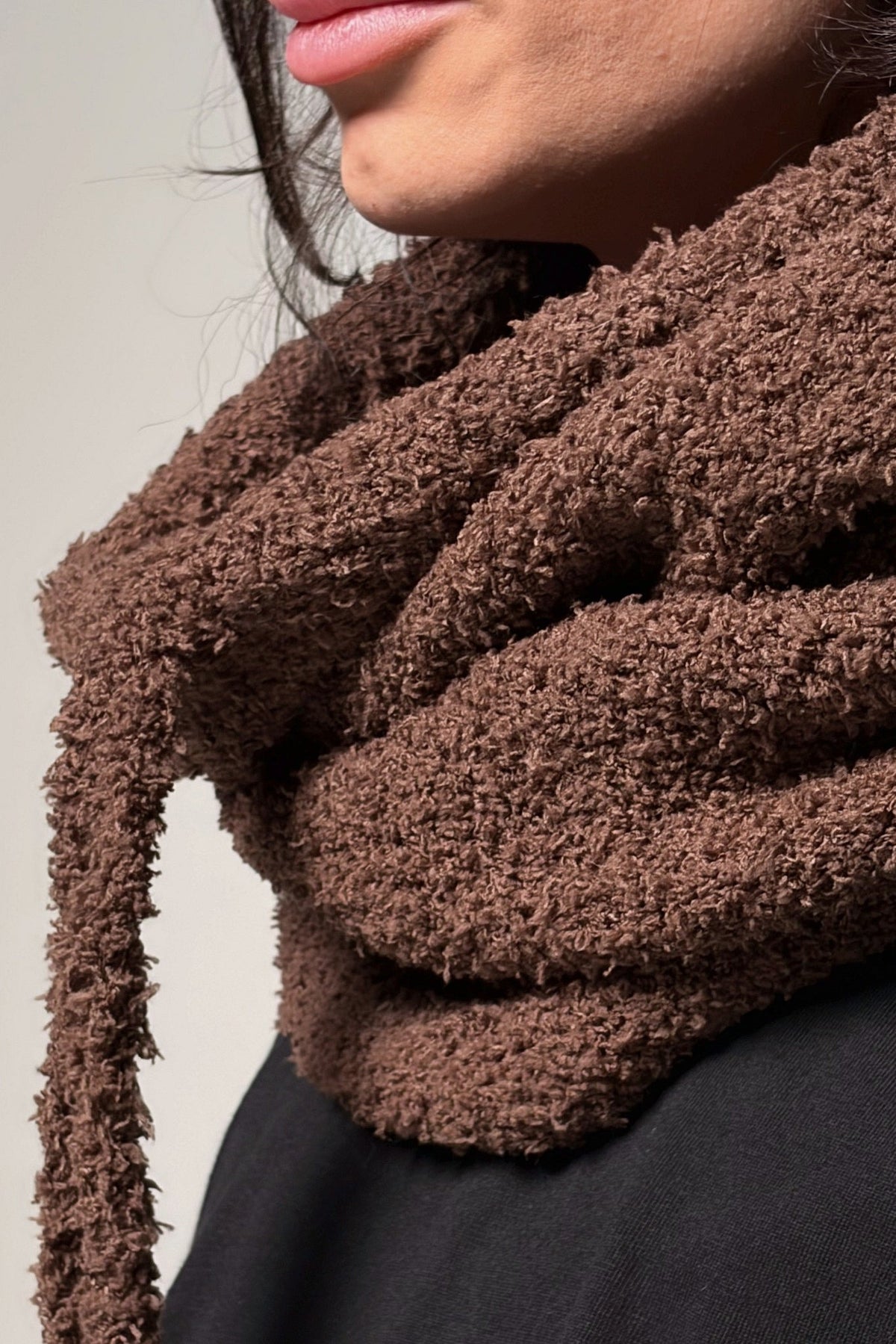 Convertible brown hooded cowl scarf showing soft knit texture and drape