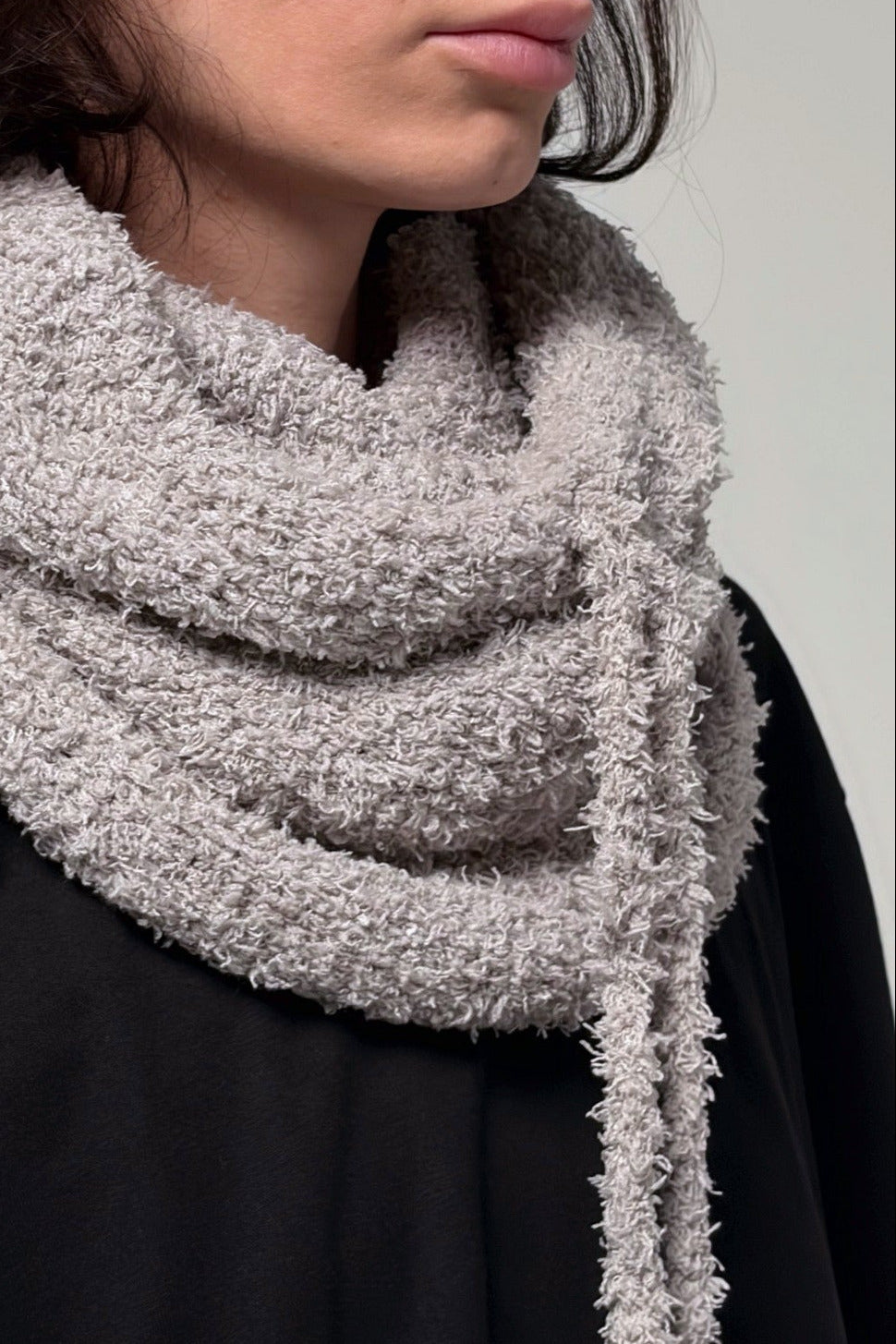 Convertible gray hooded cowl scarf showing soft knit texture and relaxed drape