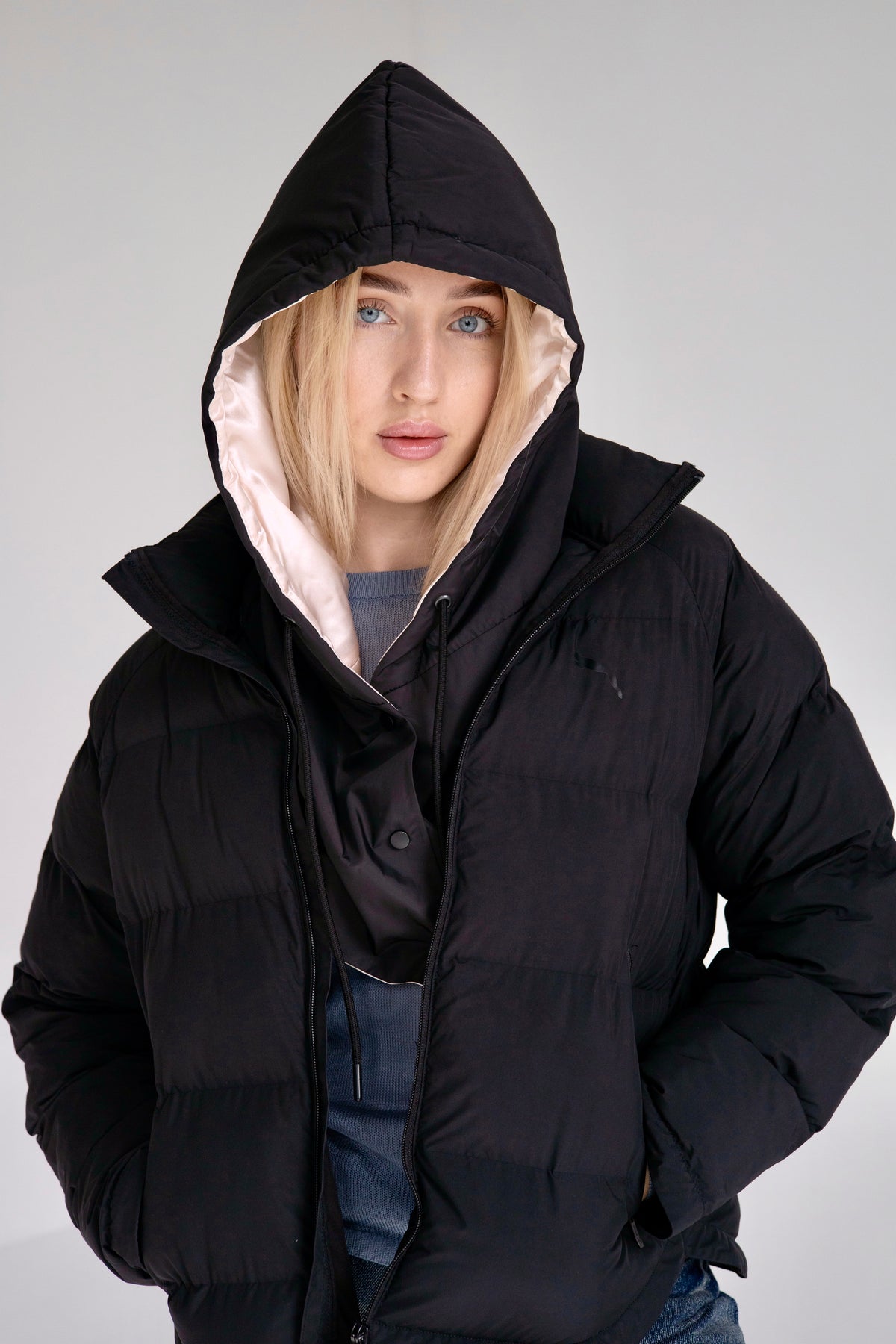 Ivory peach waterproof hooded scarf styled over outerwear for rainy weather