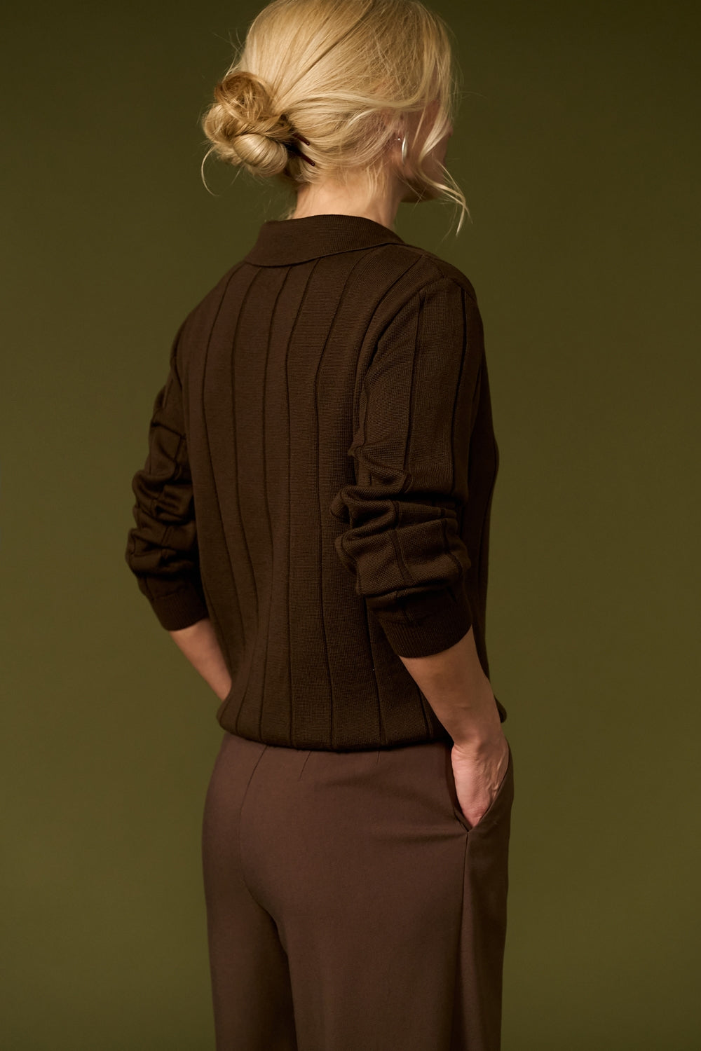 Cashmere polo sweater detail showing textured knit, open collar and ribbed finish