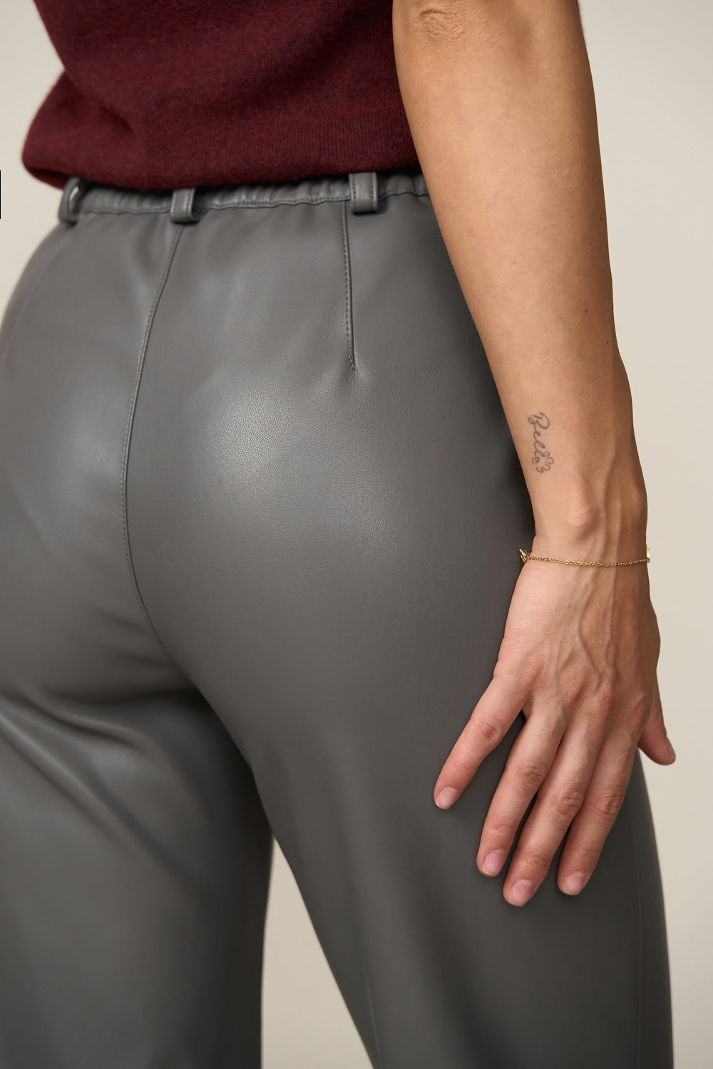 Straight leg faux leather pants with clean structured silhouette