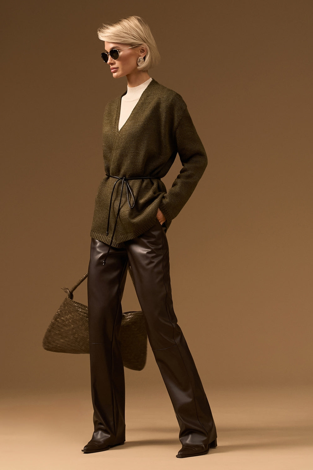 High waisted faux leather trousers with straight leg silhouette