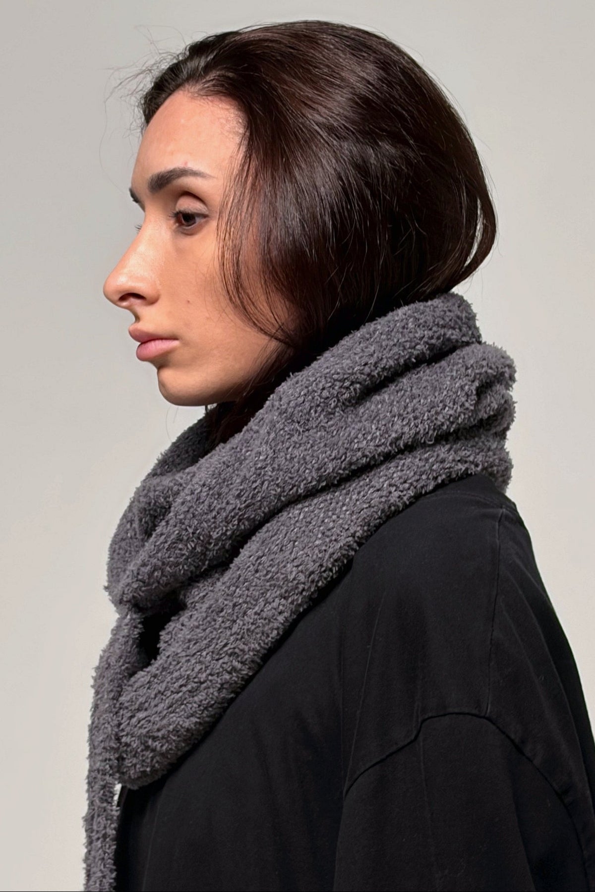 Dark gray knit cowl hood showing pull-on shape and head and neck coverage